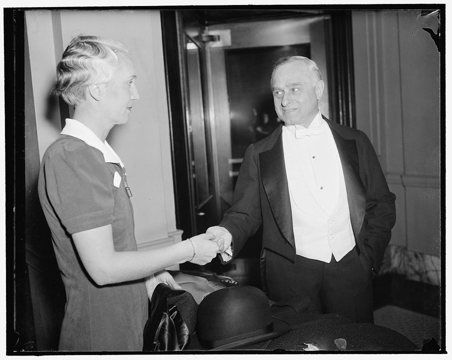 Annual Gridiron dinner. Washington, D.C., Dec. 9. Justice Felix Frankfurter, as he checked his hat and coat before attending the annual Gridiron dinner in honor of the president LC